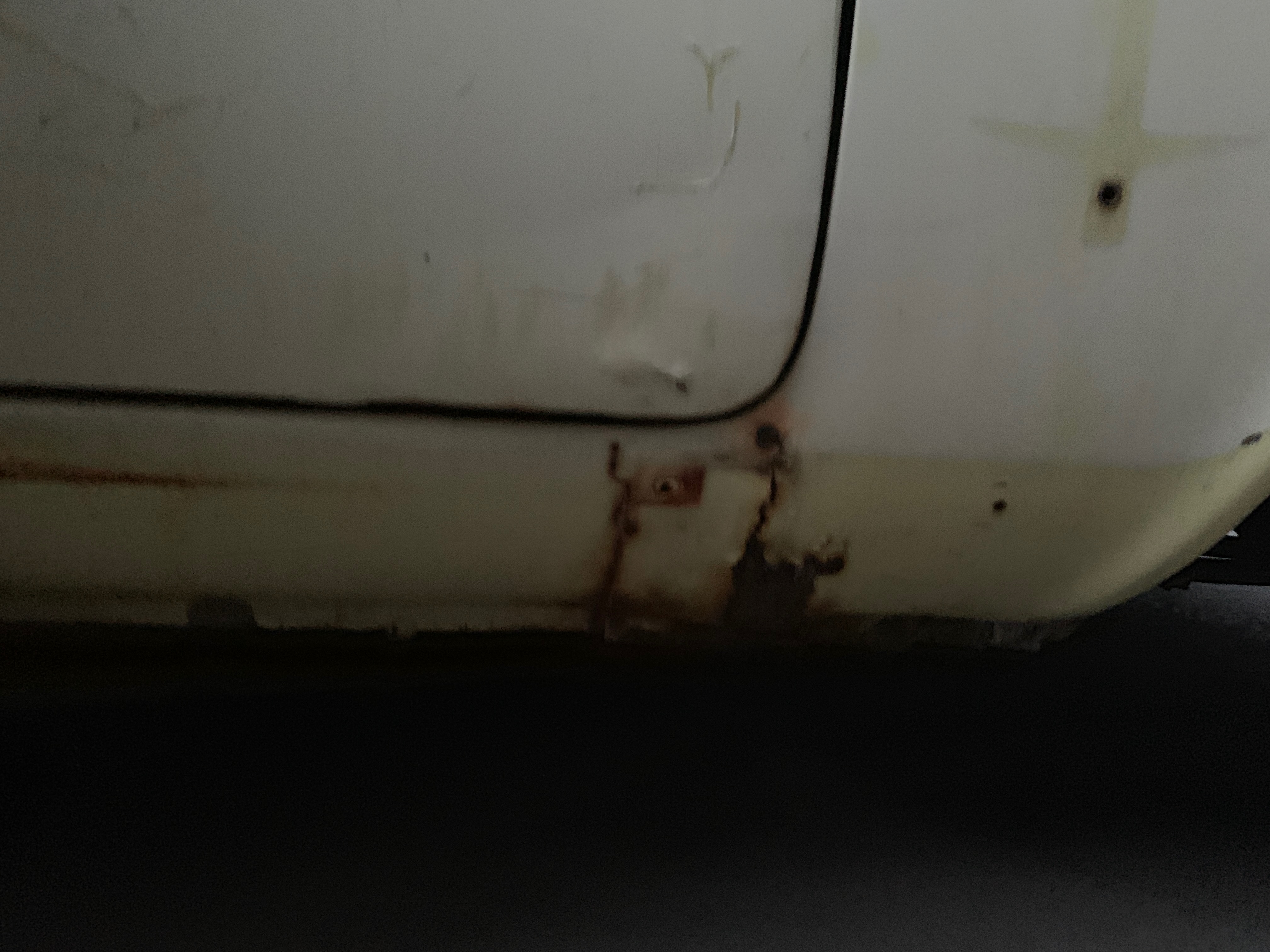 Rusted rocker panels on 1964 Corvair pre-restoration