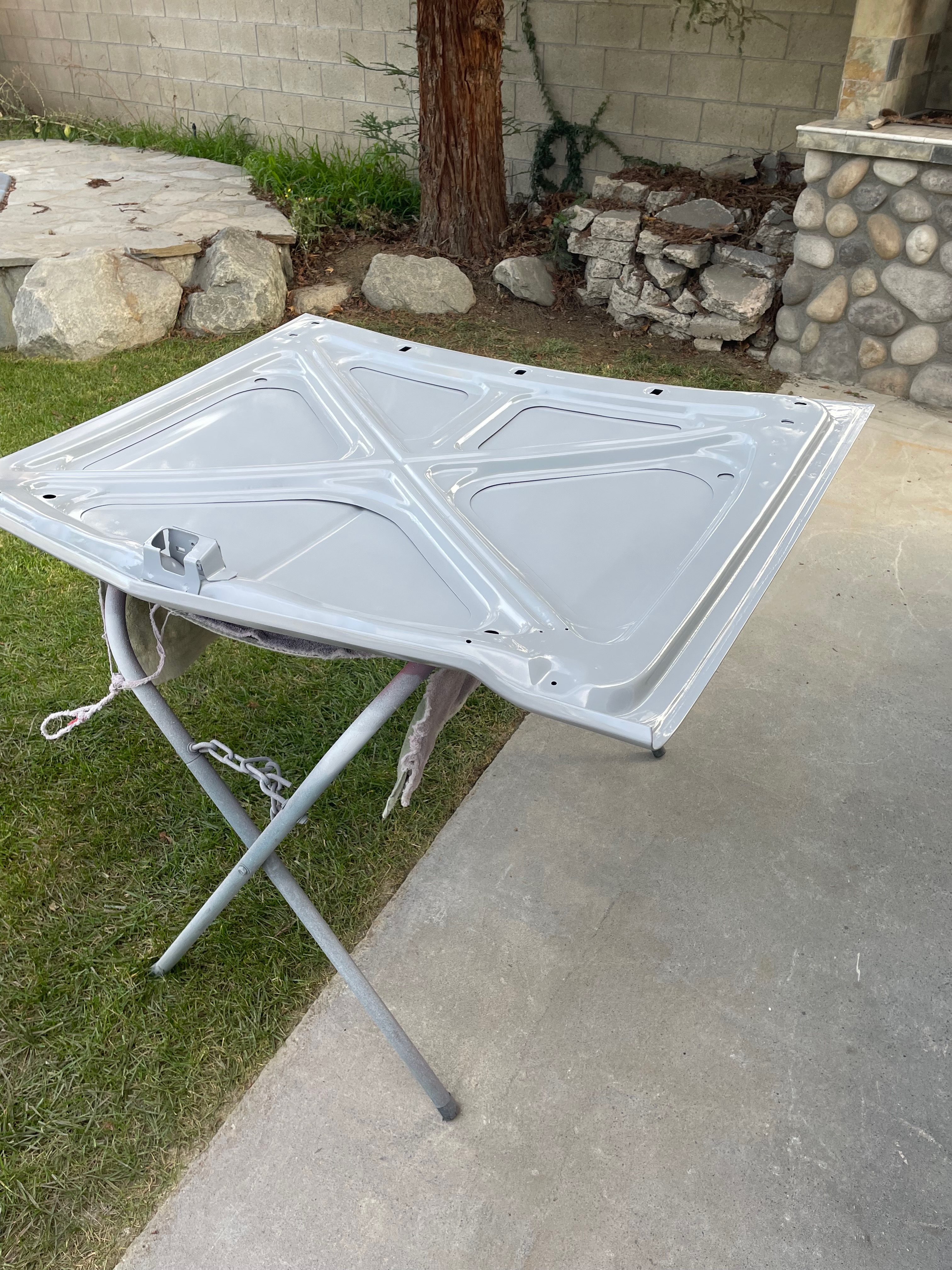 1964 Corvair hood preparation on both sides during body-paint phase