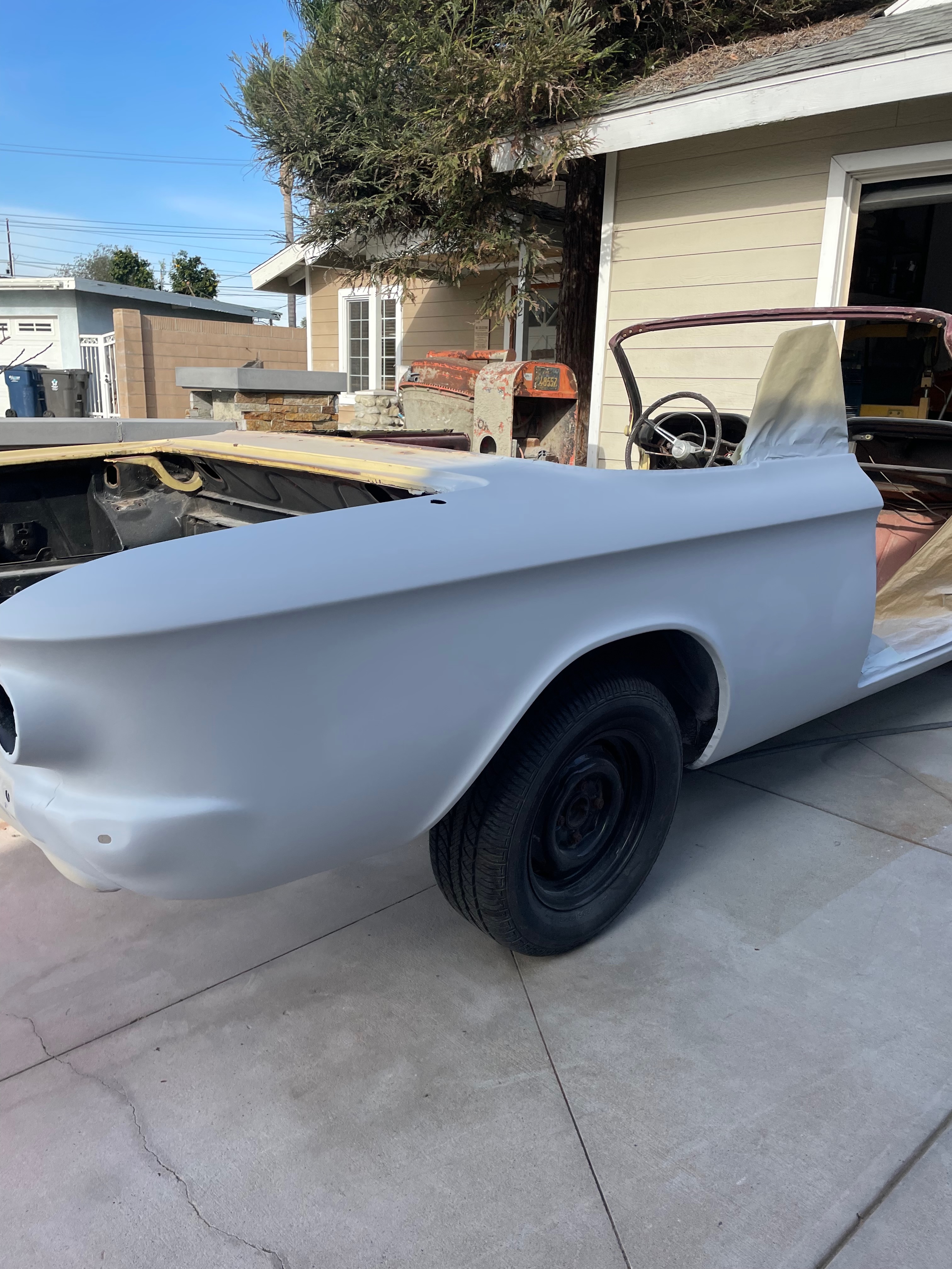 1964 Corvair chrome trim installation during body-paint phase