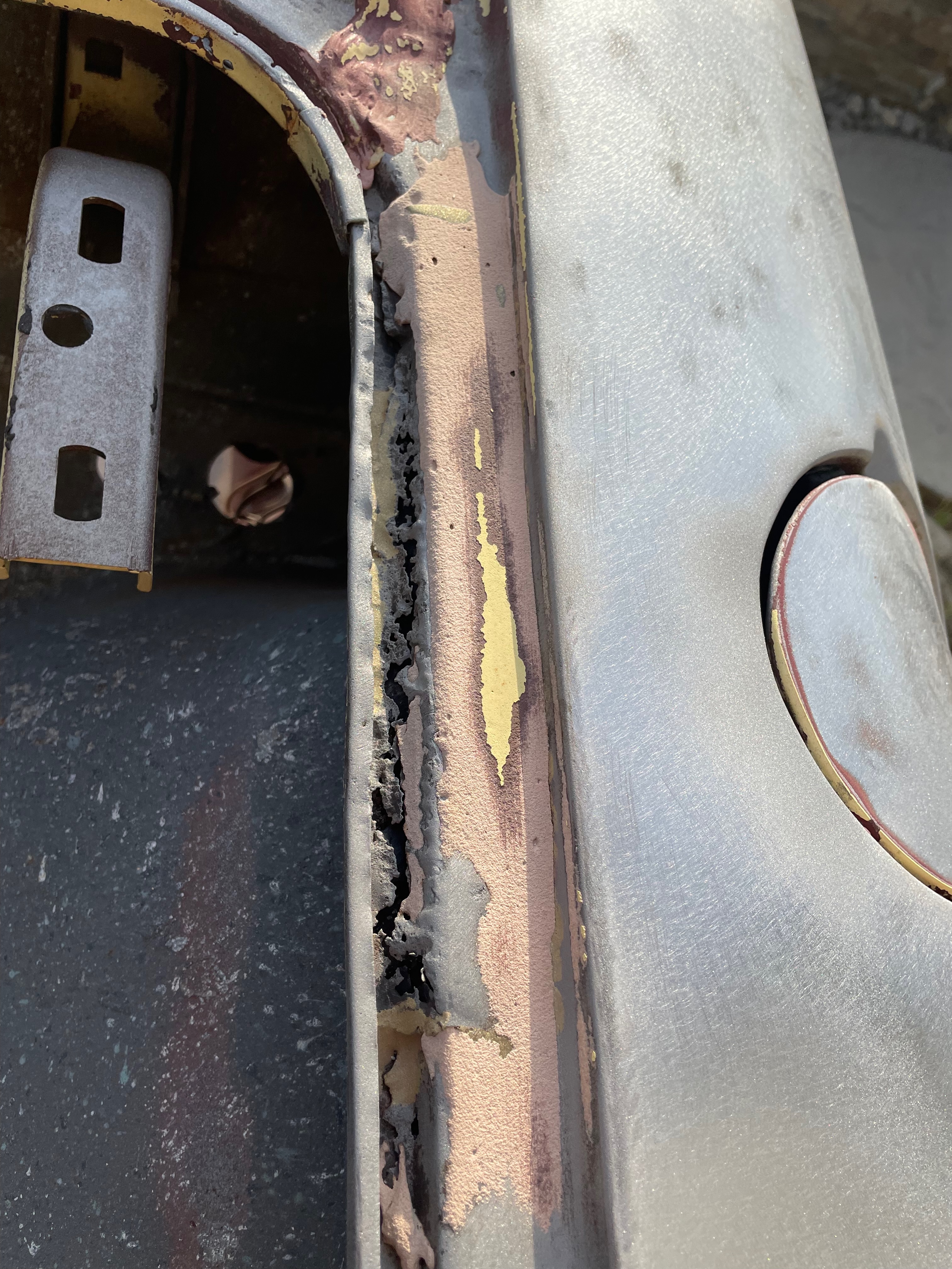 1964 Corvair body panel repair during body-paint phase
